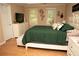 Spacious bedroom with tasteful décor and ample natural light from multiple windows at 1473 Wildwood Way, Hampton, GA 30228