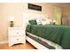 Relaxing bedroom offers serene décor, a plush bed, and ambient bedside lighting at 1473 Wildwood Way, Hampton, GA 30228