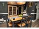 Chic dining area with french doors, table for six, and modern decor, perfect for entertaining guests in style at 1473 Wildwood Way, Hampton, GA 30228