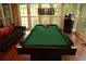 The spacious game room has a pool table and lots of natural light at 1473 Wildwood Way, Hampton, GA 30228
