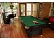 This recreation room features a pool table, bar, and great natural light at 1473 Wildwood Way, Hampton, GA 30228