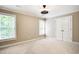 Bedroom featuring neutral walls, carpet and a ceiling fan at 35 Inverleigh Row, Covington, GA 30014