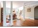 Spacious dining room with hardwood floors, columns, and staircase at 35 Inverleigh Row, Covington, GA 30014