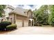 Two-car garage, a small balcony, and a brick exterior at 35 Inverleigh Row, Covington, GA 30014