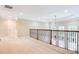 A view of the upstairs loft overlooking the foyer at 35 Inverleigh Row, Covington, GA 30014