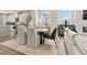 Dining area next to kitchen and living room with table and seating at 55 Peeples Dr, Lawrenceville, GA 30046