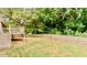 A backyard with a deck and a privacy fence at 6914 N Baggett Rd, Douglasville, GA 30134