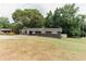 Attractive brick home featuring neat landscaping and a large, grassy yard at 6914 N Baggett Rd, Douglasville, GA 30134