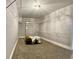 Walk-in closet with shelving, storage, and a centered ottoman at 6914 N Baggett Rd, Douglasville, GA 30134