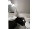 Modern bathroom featuring a dark vanity, sleek sink, and a low-profile toilet at 782 Myrtle Ne St # B, Atlanta, GA 30308
