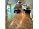 Hardwood floors, a futon, and a view towards the kitchen and back door create an inviting space at 782 Myrtle Ne St # B, Atlanta, GA 30308