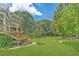Expansive backyard with lush green lawn and mature trees at 2010 Bennett Rd, Grayson, GA 30017
