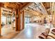 Unfinished basement with exposed wooden beams, lighting fixtures, and concrete floor at 2010 Bennett Rd, Grayson, GA 30017