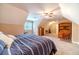 Cozy bedroom with carpet, ceiling fan, and a window view of the outside at 2010 Bennett Rd, Grayson, GA 30017