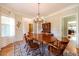 Elegant dining room featuring hardwood floors, chandelier lighting, and neutral paint at 2010 Bennett Rd, Grayson, GA 30017