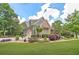 Well-manicured lawn and lush landscaping complement this beautiful home with an attached garage at 2010 Bennett Rd, Grayson, GA 30017