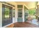 Inviting covered front porch with classic rocking chairs, creating a cozy and welcoming entrance at 2010 Bennett Rd, Grayson, GA 30017