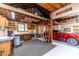 Inside the garage featuring a car, workbench, cabinets, and storage loft at 2010 Bennett Rd, Grayson, GA 30017