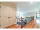 Hallway with hardwood floors, leading to various rooms, offering seamless flow and accessibility at 2010 Bennett Rd, Grayson, GA 30017