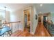 Upstairs hallway with decorative railings, offering an open view to the living area below at 2010 Bennett Rd, Grayson, GA 30017