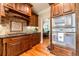 Elegant kitchen with custom wood cabinetry, stainless steel appliances, and a mosaic tile backsplash at 2010 Bennett Rd, Grayson, GA 30017