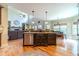 Spacious kitchen with a large island, granite countertops, stainless steel appliances, and hardwood floors at 2010 Bennett Rd, Grayson, GA 30017