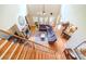 Open-concept living room with fireplace, soaring ceilings, and plentiful windows, creating a bright, airy space at 2010 Bennett Rd, Grayson, GA 30017