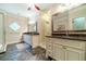 Luxurious main bathroom with double vanities, granite countertops, and a glass-enclosed shower at 2010 Bennett Rd, Grayson, GA 30017