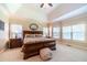 Spacious main bedroom with a large bed, vaulted ceiling, and plenty of natural light from multiple windows at 2010 Bennett Rd, Grayson, GA 30017