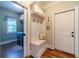 Mudroom with built-in bench, storage, and hooks, providing an organized entry point with easy access to laundry at 2010 Bennett Rd, Grayson, GA 30017