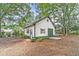 Exterior of the outbuilding with a view of the side door and space for parking at 2010 Bennett Rd, Grayson, GA 30017