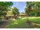 A sprawling green backyard, surrounded by lush trees, attached to a lovely home at 3746 Gladney Dr, Atlanta, GA 30341