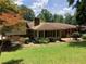 Backyard view with a well-maintained lawn, providing a beautiful outdoor retreat at 3746 Gladney Dr, Atlanta, GA 30341