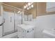 Cozy bathroom featuring a shower with glass door, vanity, and bright lighting at 3746 Gladney Dr, Atlanta, GA 30341