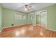 This bedroom offers hardwood floors, natural light from the windows, and closet storage at 3746 Gladney Dr, Atlanta, GA 30341