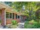 Brick exterior of the house with windows and neat landscaping along the walkway at 3746 Gladney Dr, Atlanta, GA 30341