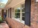Classic brick home featuring shuttered windows, adding character and charm to the exterior at 3746 Gladney Dr, Atlanta, GA 30341