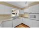 Modern kitchen with white cabinetry, stainless steel appliances, and plenty of counter space at 3746 Gladney Dr, Atlanta, GA 30341