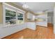Bright kitchen features wood floors, white cabinets, and a garden view at 3746 Gladney Dr, Atlanta, GA 30341