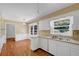 Bright kitchen featuring white cabinets, updated countertops, and stainless steel sink at 3746 Gladney Dr, Atlanta, GA 30341