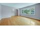 Light-filled living room with hardwood floors and fresh paint, offering a cozy atmosphere at 3746 Gladney Dr, Atlanta, GA 30341