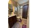 Bathroom with a shower-tub combo, vanity, and toilet at 1604 Haven Cir, Douglasville, GA 30135