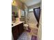 Bathroom with a shower-tub combo, vanity, and toilet at 1604 Haven Cir, Douglasville, GA 30135
