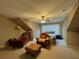 Cozy bedroom featuring a ceiling fan, sitting area, and large window at 1604 Haven Cir, Douglasville, GA 30135