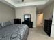 Bedroom with ceiling fan, neutral decor, and dark furniture at 1604 Haven Cir, Douglasville, GA 30135