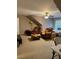 Cozy bedroom featuring a ceiling fan, sitting area, and large window at 1604 Haven Cir, Douglasville, GA 30135