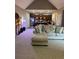 Open living room with kitchen, stainless appliances, and breakfast bar at 1604 Haven Cir, Douglasville, GA 30135