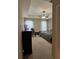 Well lit main bedroom featuring carpet floors, a fan, and sheer curtains for privacy at 1604 Haven Cir, Douglasville, GA 30135