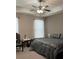 Main bedroom with a ceiling fan, carpet, and curtains for a relaxing atmosphere at 1604 Haven Cir, Douglasville, GA 30135