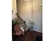 Stairwell with chair lift for easy access between floors and a hardwood landing at 1604 Haven Cir, Douglasville, GA 30135